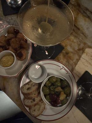 Pigs in a blanket and marinated olives