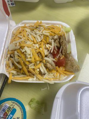 Flavorless chicken salad with too much cheese and onions