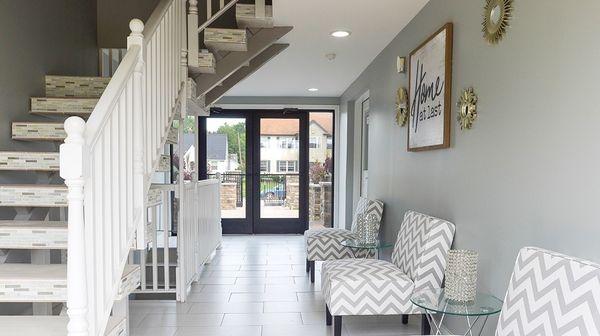 Walkway from courtyard to Logan St. Just past 3rd chair is office door