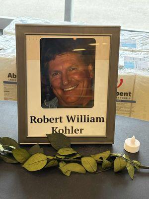 A well respected employee passed away. A memorial to him by entrance.