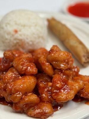 Delicious Orange Chicken lunch plate with steamed rice and egg roll