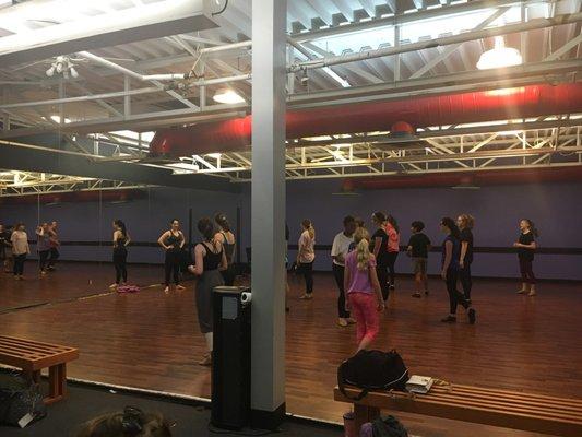 A mirror at the front of the room and a decent size dancing area for students.