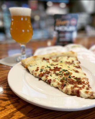Carbonara slice and a beer