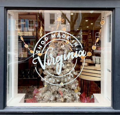 Shop Made in Virginia logo on the window and silver Christmas tree behind it.