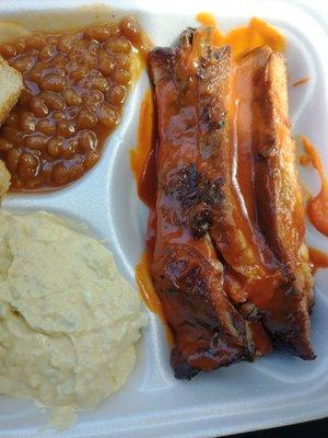 Pork Ribs Dinner with baked beans and potato salad.