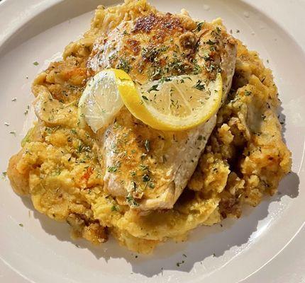 Grilled Salmon over Seafood Dressing