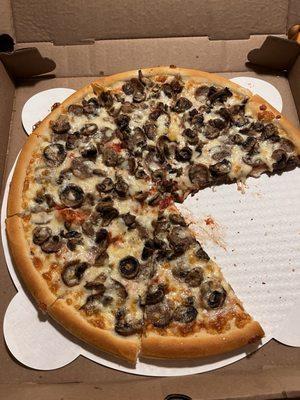 Large sausage and mushroom pizza.