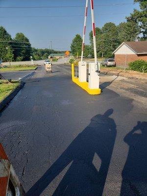 Asphalt sealcoating