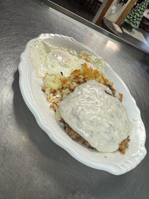 Country fried steak covered in our creamy sausage gravy, eggs, and crispy hash browns