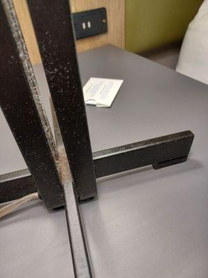 Dirty lampstand next to bed