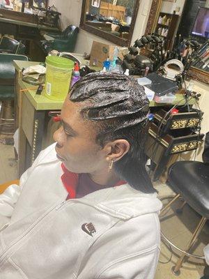 Finger wave with hair added in the back.