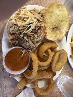 Pulled pork with onion rings.