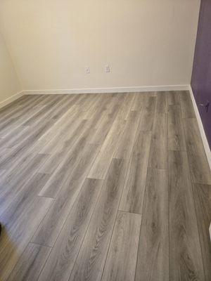 Upstairs bedroom. Replaced carpet with LVT plank and new baseboards.