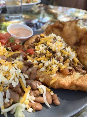 Fry bread tacos with pintos and pico. I got the chipotle crema on the side.