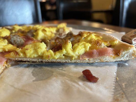 Breakfast pizza slice