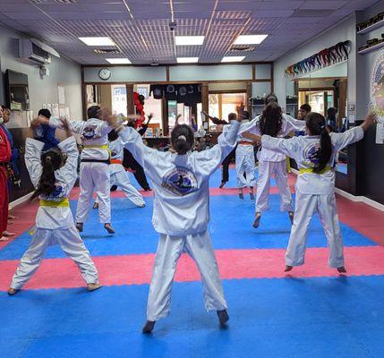 No Belt Class doing Jumping Jacks