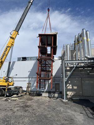 Removing Metal Stairs from Building Exterior.