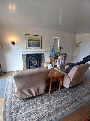 Cozy rocking chairs and fireplace in room 16