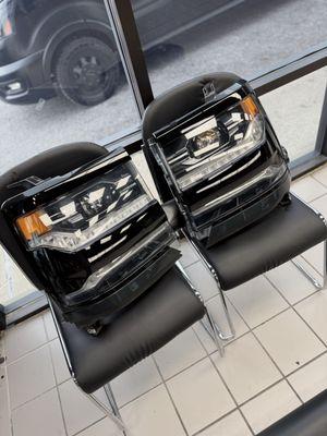 Chrome housing on headlights wrapped in 3M gloss black vinyl