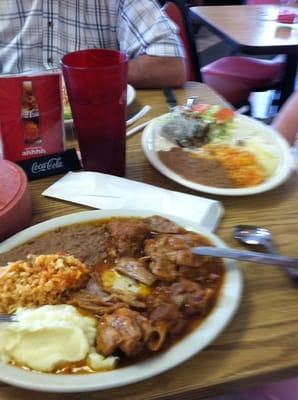 Chile relleno en nogada in the back, cabrito up front
