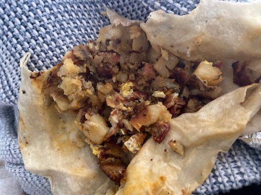 Just potatoes for $12. Eggs aren't that expensive, why is this happening? Also a very very small Morning Bacon Breakfast Burrito