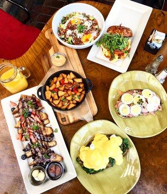 Left to Right: French Toast, Side of Breakfast Potatoes, Veggie Benedict, Salmon Lux, Breakfast Sandwhich, Huevos Rancheros