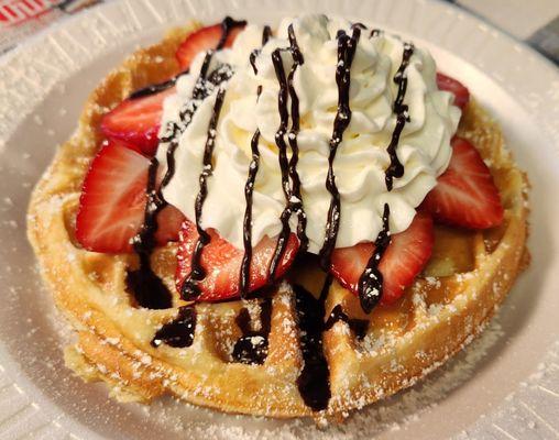 Belgian Waffle, added strawberries, whipped cream, chocolate sauce and dusted with powder sugar.