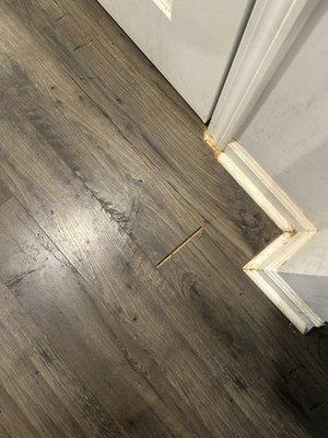 Separating flooring creating a trip/fall hazard.