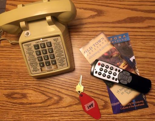 Lazy 8 kickin' it old school with push button phone and an actual key.