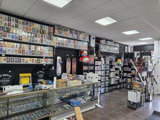 Our case of pokemon singles and our mass collection of Funkos. Along with toys, plushies, and vinyls.