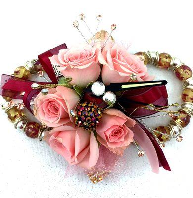 Steampunk wrist corsage with ponk spray roses, copper and burgundy embellishments