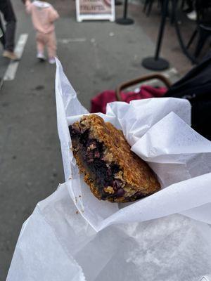 Blueberry granola bar. It's good but the person in charge of the booth old white guy tried to ignore me so it left bad taste in mouth