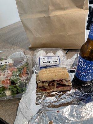 Half of my sandwich, small house salad , wedding cookies and blueberry soda.
