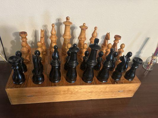 extra big chess set .all wooden and ( box opens up as the game board ) and pieces fit inside the box I. Love it