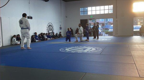 My Daughter earning her first stripe in the martial art of Brazilian Jiu Jitsu! She was so proud of her self.
