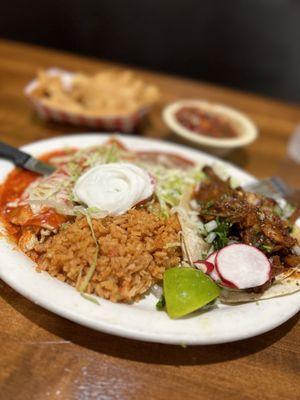 Chicken enchilada, and Pastor taco with rice and beans.