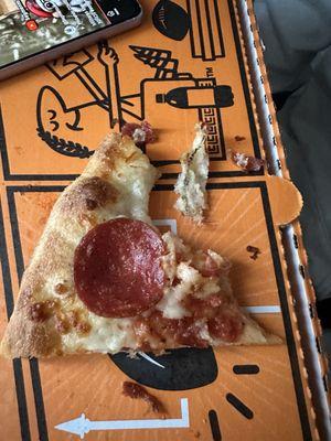 So much hair/something in this piece of pizza