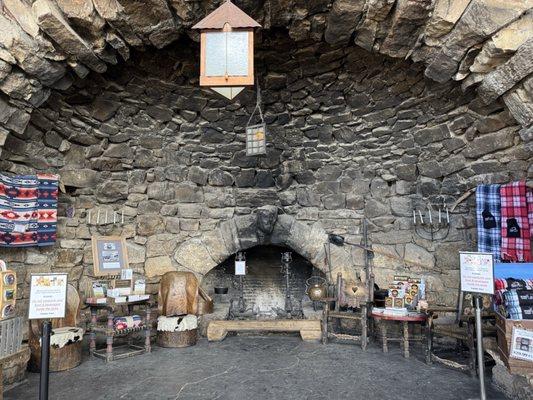 Fireplace decorated to look aged back when it was originally built, still looks aged to this day :)