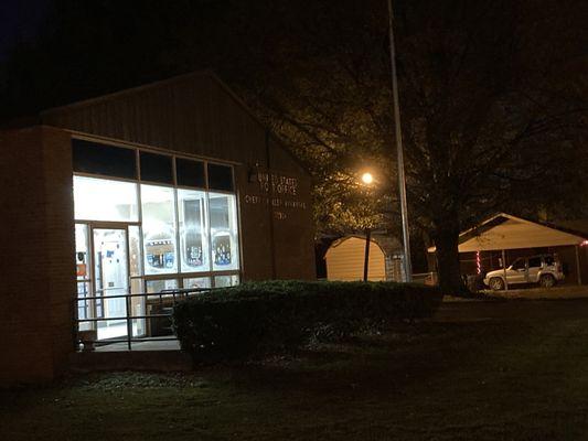view of illuminated lobby of post office (after dusk)