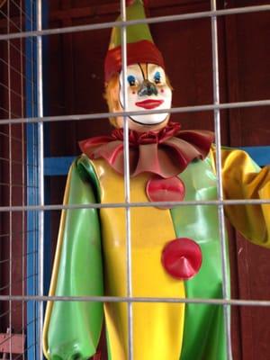 Scared caged clown
