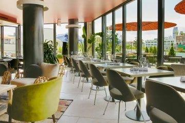 Cocktail Bar Interior. 360 degree Floor to ceiling windows. Cozy setting.