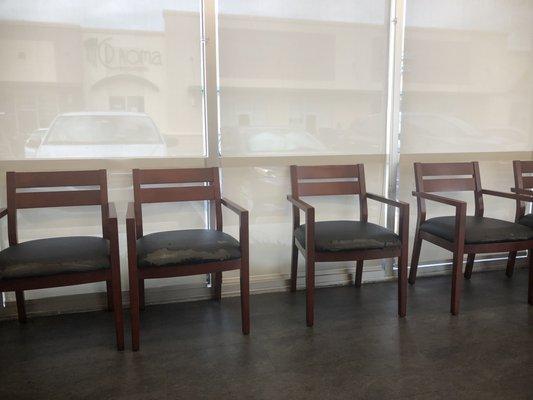 Torn chairs badly needing replacement