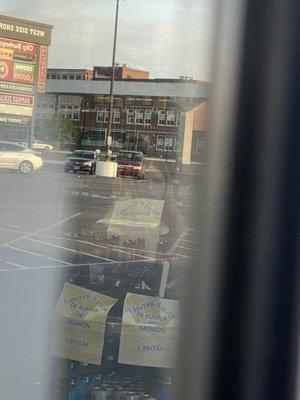 Cashier counting the drawer down while the door is locked BEFORE closing hours