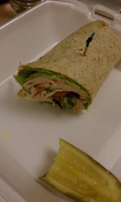 1/2 of my lunch.  Turkey Wrap with cucumber, olives & sprouts....and a wedge of a pickle.