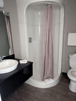 Shower was ok but flooring is coming up from floor and cheap toilet seat won't stay up bathroom sink water pressure is awful