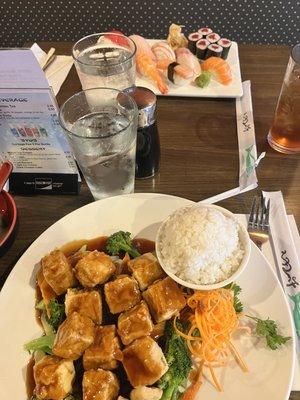 Tofu veggie teriyaki entree and sushi