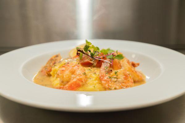 Shrimp Scampi, Shrimp sautéed in lemon, garlic white wine sauce served over polenta, topped with chopped parsley and chili flake