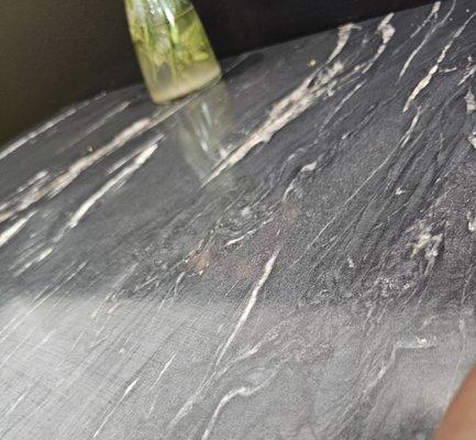 The table was dirty, the guy wearing the red hat. Just sat there.