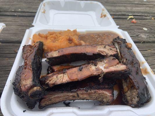 Half Rack Pork Ribs Platters with beans and Yams with Apples. Ribs looked much better than they tasted. Blackened and burned.