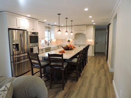 Entire first floor remodel to include opening up the kitchen to seat many in this very busy family!